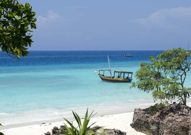 bigstock-Wooden-boat-on-turquoise-water-56435930