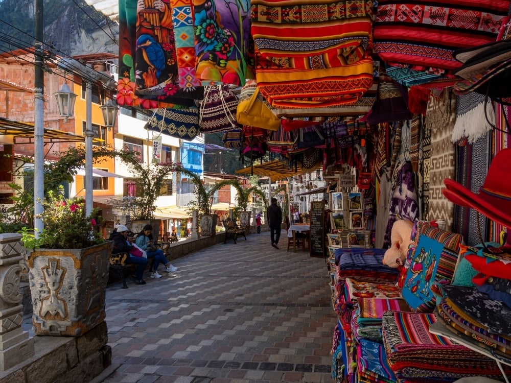 Market with bright fabrics at Aguas Calientes