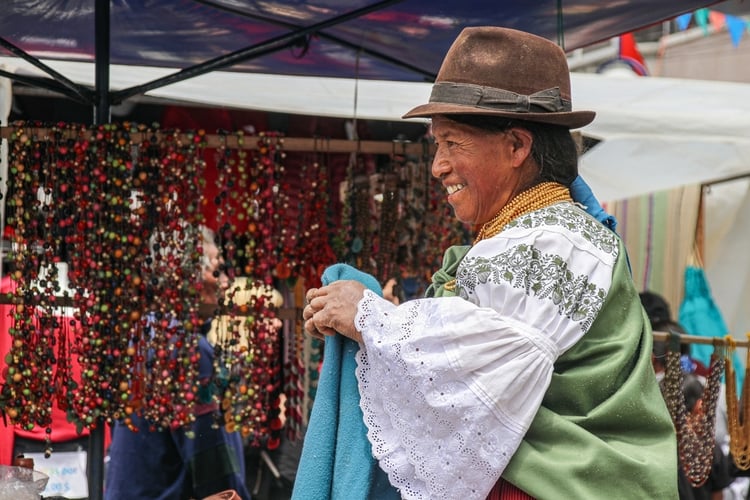 Smiling local vendor in Ecuador