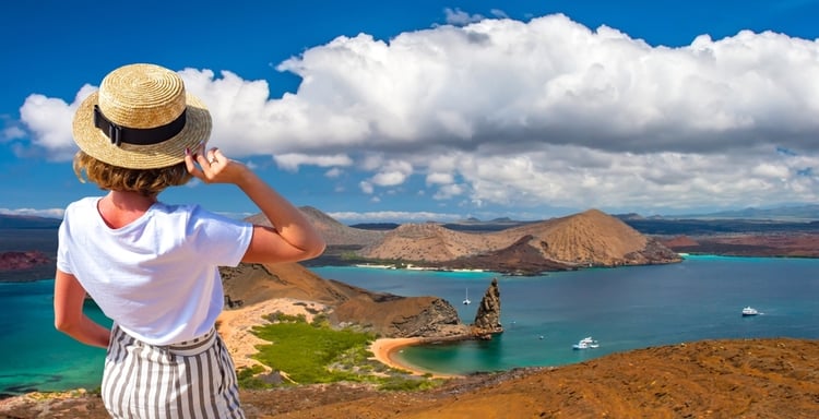 Woman standing on the coastline of the Galapagos Islands