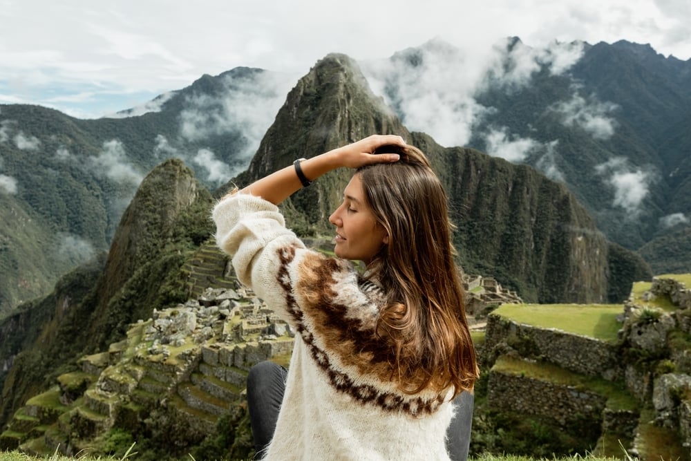 Young woman posing at high altitude at Machu Picchu