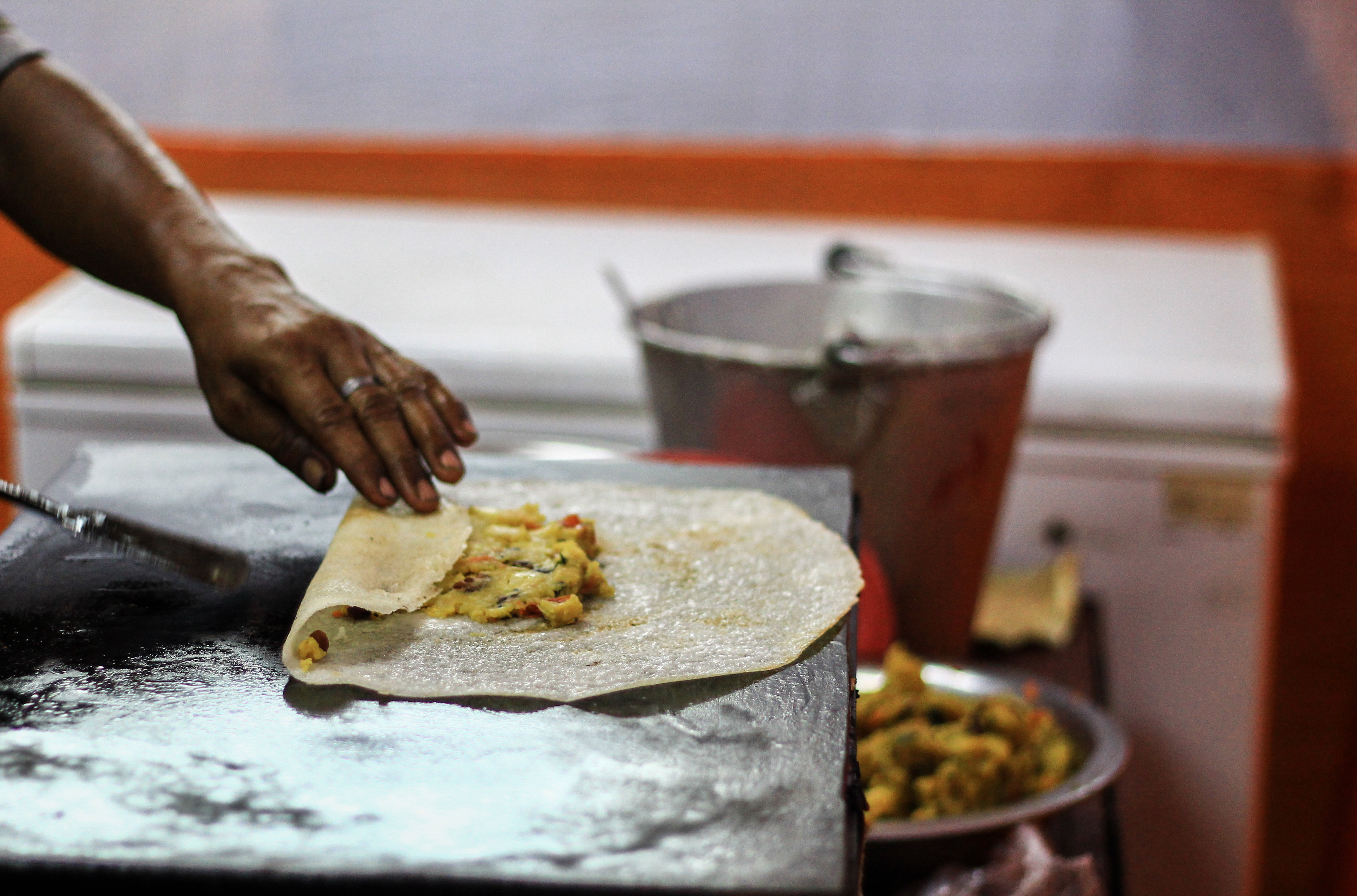 bigstock-Folding-Dosa-After-Adding-Pota-250425892