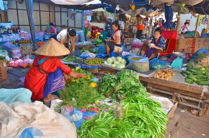 bigstock-Woman-sells-vegetables-45128647